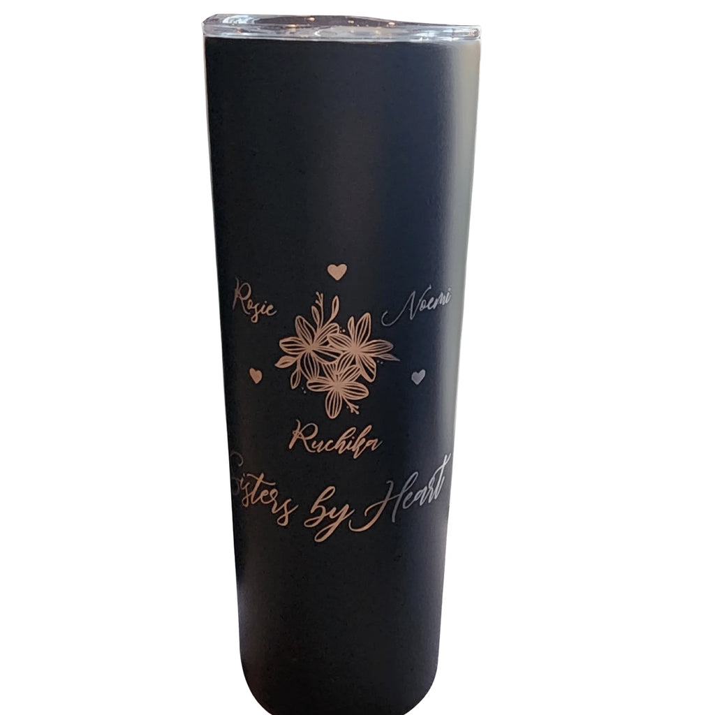 Black tumbler with floral and text design on a white background