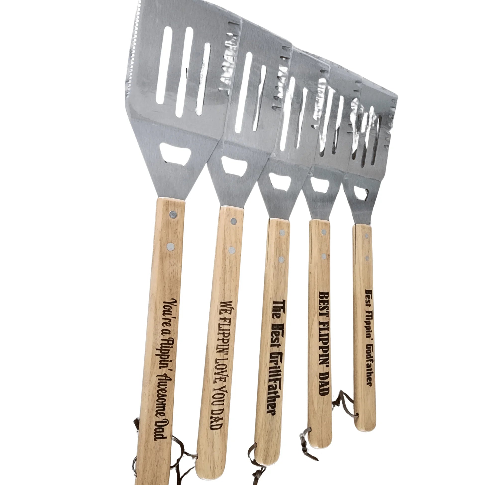 Set of four barbecue utensils with wooden handles and engraved text on a white background