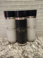 Three  with black, silver, and white design on a marble surface.