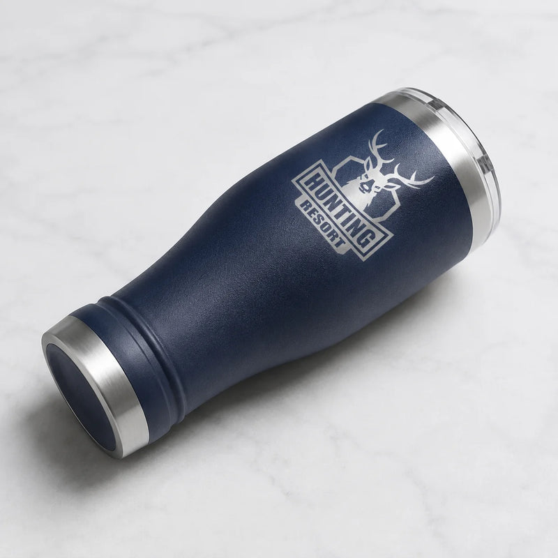 A navy blue insulated tumbler with stainless steel trim, featuring a white laser-engraved logo of a deer head and the text 'HUNTING RESORT'.