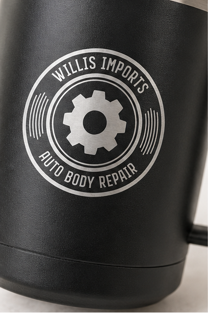A collage showing a black handled insulated mug from multiple angles, with a clear lid and a circular 'WALLIS IMPORTS AUTO BODY REPAIR' gear logo printed on the side. The mug is shown on a light surface, on a wooden table with wrenches, open to reveal the stainless interior, and close-up to show the lid and logo detail.