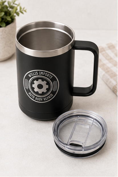 A collage showing a black handled insulated mug from multiple angles, with a clear lid and a circular 'WALLIS IMPORTS AUTO BODY REPAIR' gear logo printed on the side. The mug is shown on a light surface, on a wooden table with wrenches, open to reveal the stainless interior, and close-up to show the lid and logo detail.