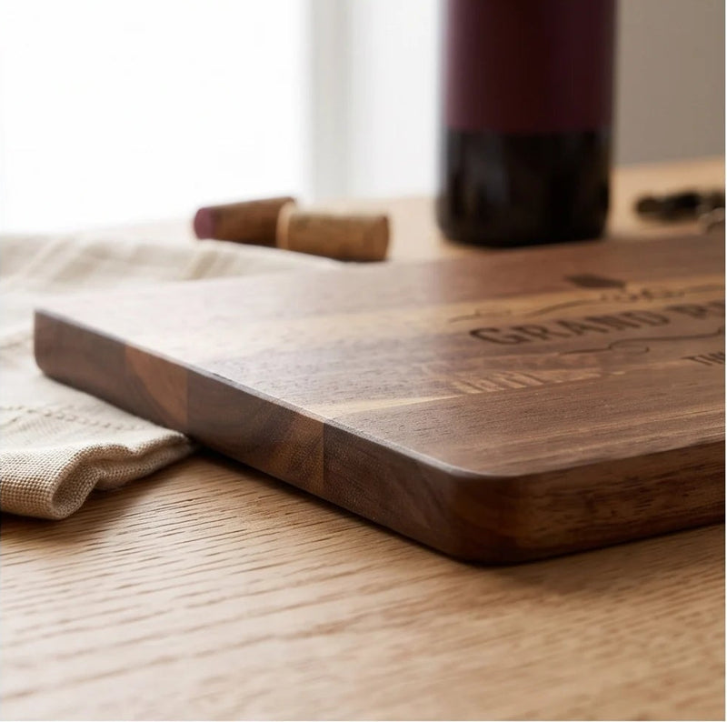 A four-panel collage showing a wooden cutting board engraved with 'GRAND RESERVE THE CORK WINE BAR' and a wine glass icon. The board is shown from multiple angles on a wooden table with corks, a bottle, and a corkscrew nearby.