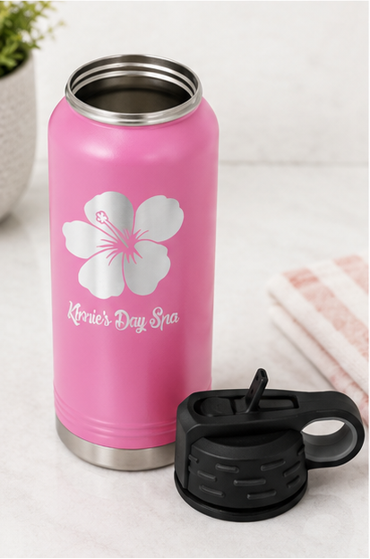 Six-panel collage showing a pink insulated water bottle from multiple angles. The bottle has a black flip-top lid, a silver hibiscus flower graphic, and the text 'Kier's Day Spa' printed near the bottom.