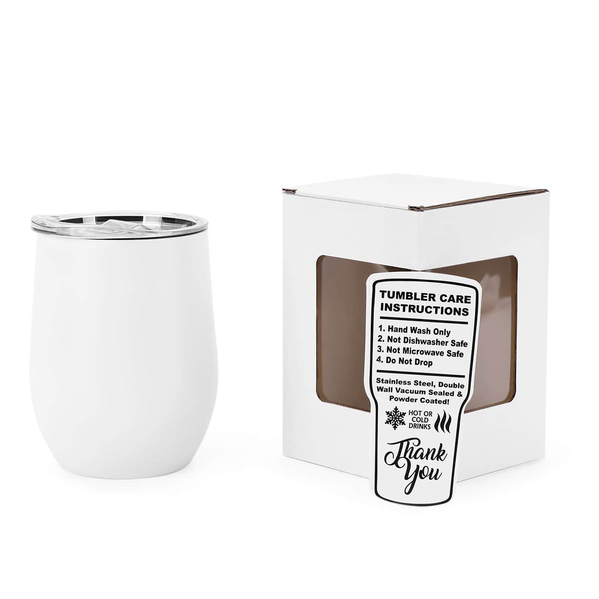 White tumbler with care instructions label next to its packaging on a white background